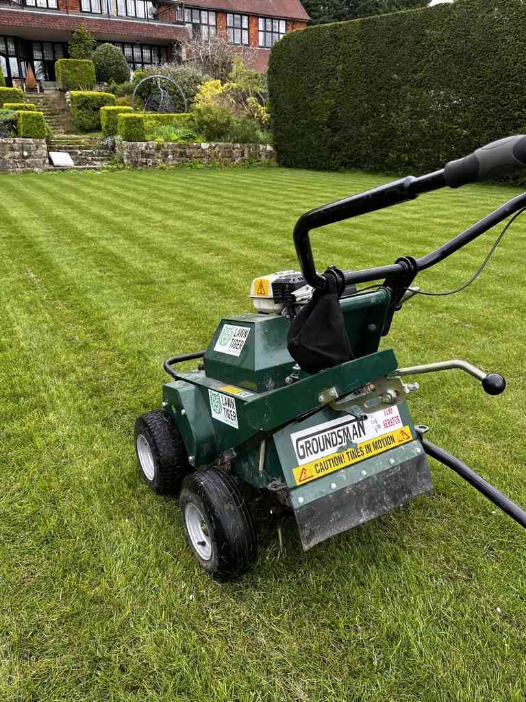 lawn aeration machine on a green lawn